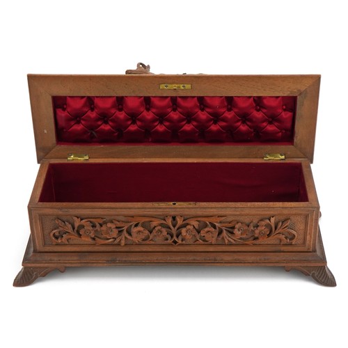 89 - 19th Century Black forest table casket with red silk button back upholstered interior finely carved ... 