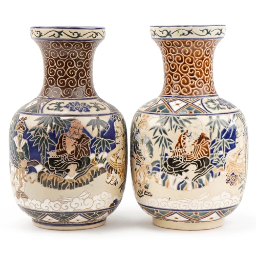 533 - Pair of Chinese porcelain vases hand painted with scholars in landscapes, each 35cm high