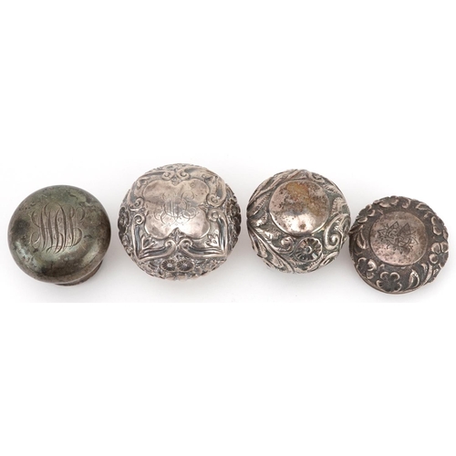 329 - Four silver scent bottle tops including floral examples, various hallmarks including London, the lar... 