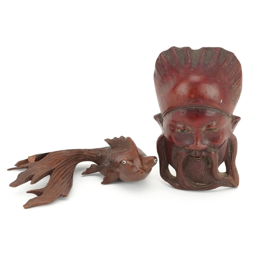 1436 - Japanese carved wooden Koi carp with beaded glass eyes together with a carved wooden face mask, the ... 