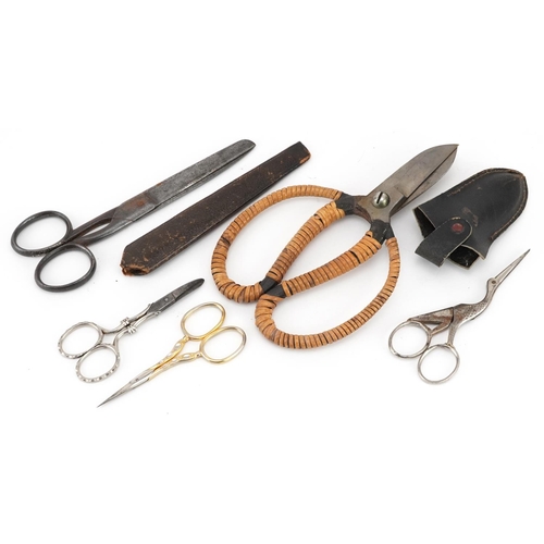 1448 - Two pairs of vintage cased scissors, pair of stork design scissors and a pair of nail scissors, the ... 