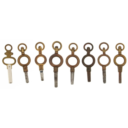 2595 - Eight brass & steel watch keys, the largest 4cm in length