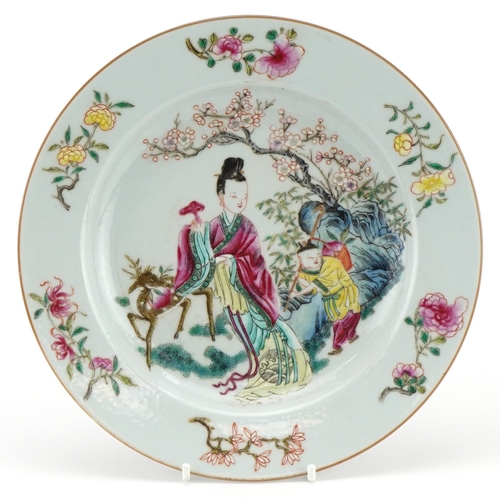 543 - Chinese porcelain plate hand painted in the famille rose palette with a mother and child carrying a ... 