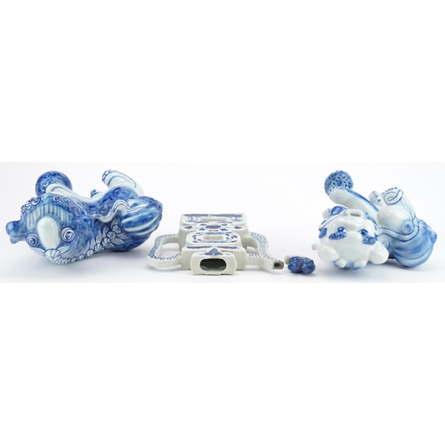 1532 - Chinese blue and white porcelain comprising two qilins and a teapot, the largest 25cm high