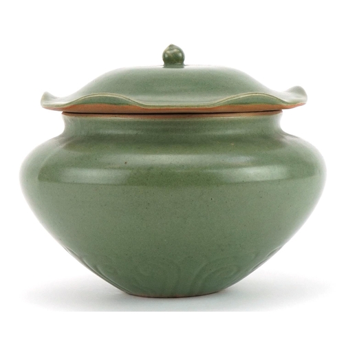 1529 - Korean porcelain jar and cover having a green glaze, 16cm high x 19cm in diameter