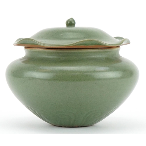 1529 - Korean porcelain jar and cover having a green glaze, 16cm high x 19cm in diameter