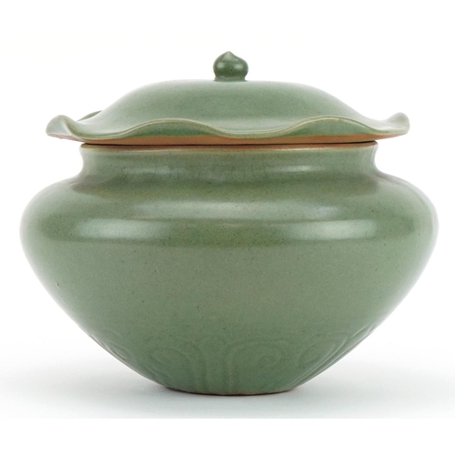 1529 - Korean porcelain jar and cover having a green glaze, 16cm high x 19cm in diameter