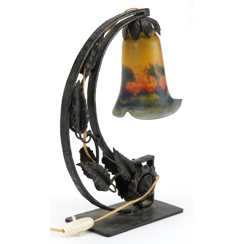 427 - Hollywood Regency style iron arch design naturalistic table lamp with frilled glass shade, the glass... 