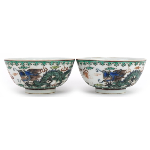 1349 - Pair of Chinese porcelain bowls hand painted in the famille verte palette with dragons chasing the f... 