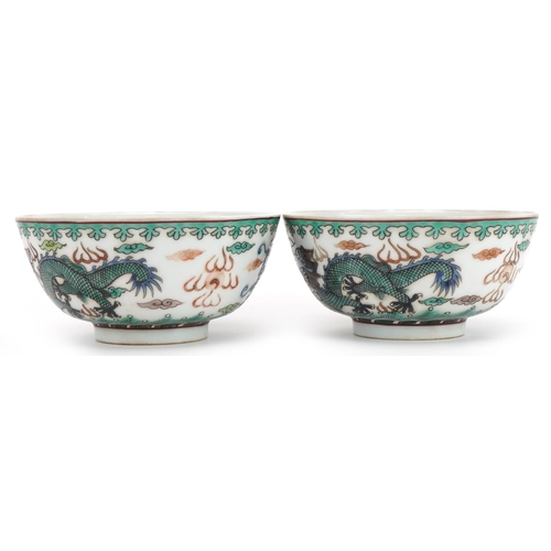 1349 - Pair of Chinese porcelain bowls hand painted in the famille verte palette with dragons chasing the f... 