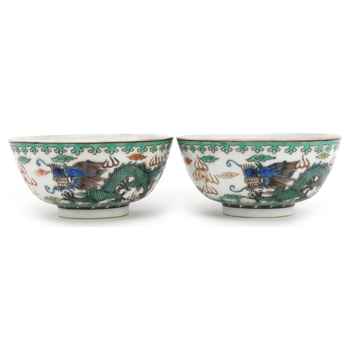 1349 - Pair of Chinese porcelain bowls hand painted in the famille verte palette with dragons chasing the f... 