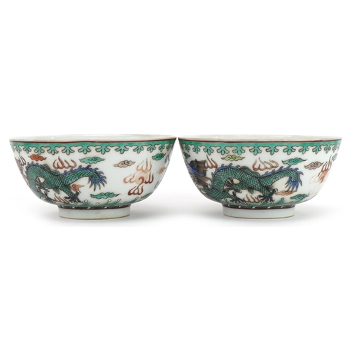 1349 - Pair of Chinese porcelain bowls hand painted in the famille verte palette with dragons chasing the f... 