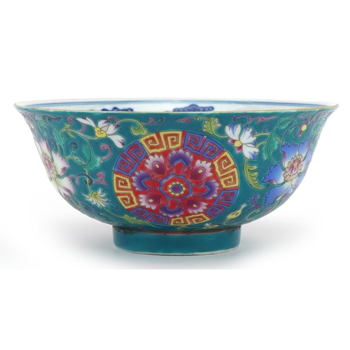 1414 - Chinese Tibetan porcelain turquoise ground footed bowl hand painted with flower heads amongst scroll... 