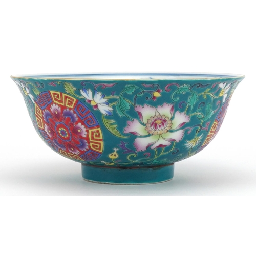1414 - Chinese Tibetan porcelain turquoise ground footed bowl hand painted with flower heads amongst scroll... 