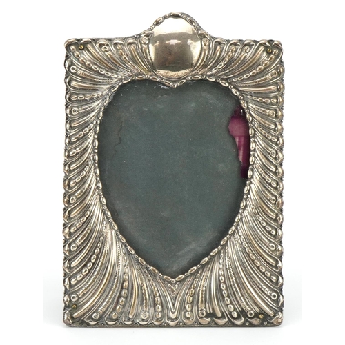 William Comyns & Sons, Victorian silver embossed photo frame with heart aperture, London 1896, 18.5cm x 13cm