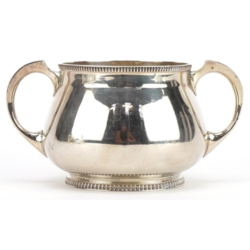 121 - Mappin & Webb, Arts & Crafts silver sugar bowl with twin handles, Sheffield 1923, 14cm wide, 271.8g