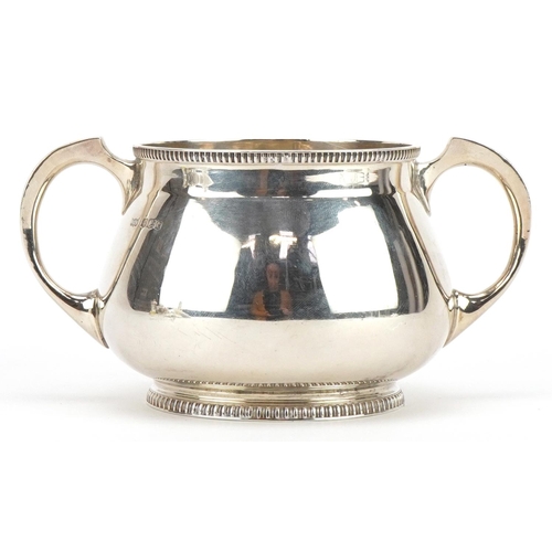 121 - Mappin & Webb, Arts & Crafts silver sugar bowl with twin handles, Sheffield 1923, 14cm wide, 271.8g