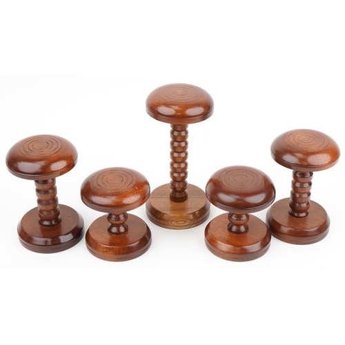 446 - Five Victorian style turned mahogany hatstands including two pairs, the largest 30cm high