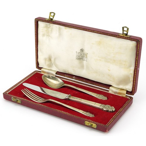 Garrard & Co, Elizabeth II silver three piece christening set housed in a Garrard & Co fitted case, 18.5cm in length, total weight 74.8g