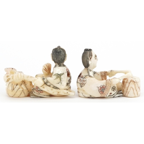 1766 - Two Japanese carved bone netsukes including a one of a drummer, the largest 5.5cm wide