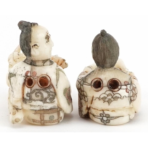 1766 - Two Japanese carved bone netsukes including a one of a drummer, the largest 5.5cm wide