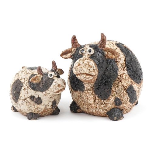 1777 - Athezza, graduated pair of mid century style pottery cows, the largest 21cm high