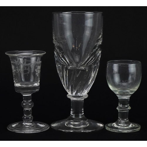 1774 - Three 18th century and later glasses including one with folded foot etched with berries, the largest... 