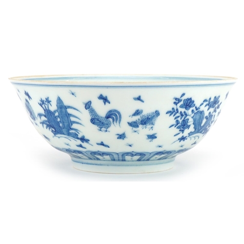 1328 - Chinese blue and white porcelain bowl hand painted with chickens in a landscape, six figure characte... 