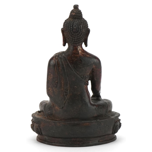 373 - Chino Tibetan partially gilt bronze figure of seated Buddha, 20.5cm high