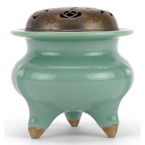 460 - Chinese porcelain tripod censer having a celadon glaze with pierced white metal lid, 9.5cm high