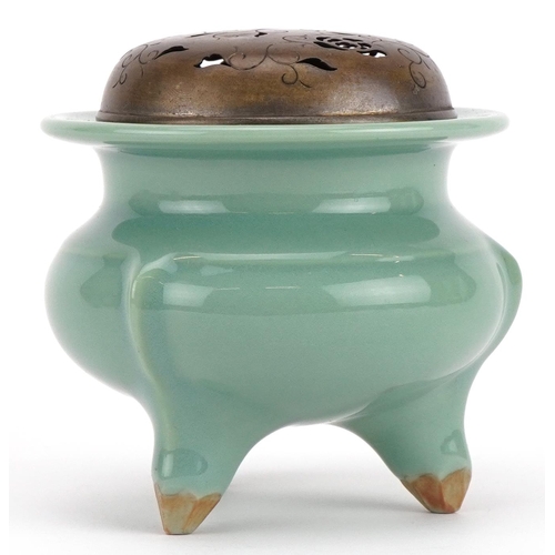 460 - Chinese porcelain tripod censer having a celadon glaze with pierced white metal lid, 9.5cm high