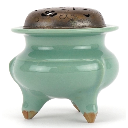 460 - Chinese porcelain tripod censer having a celadon glaze with pierced white metal lid, 9.5cm high