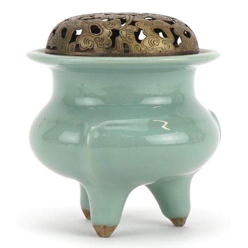 516 - Chinese porcelain tripod censer having a celadon glaze with pierced white metal lid, 10.5cm high