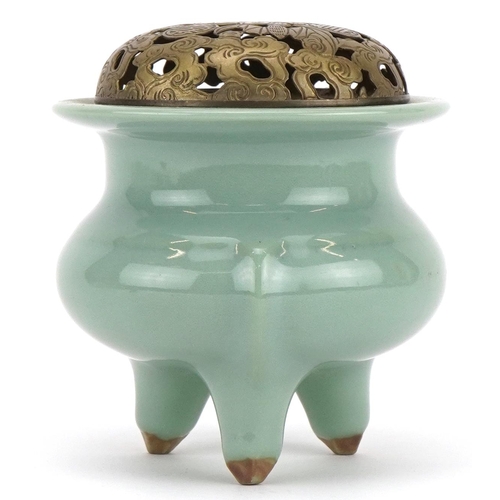 516 - Chinese porcelain tripod censer having a celadon glaze with pierced white metal lid, 10.5cm high