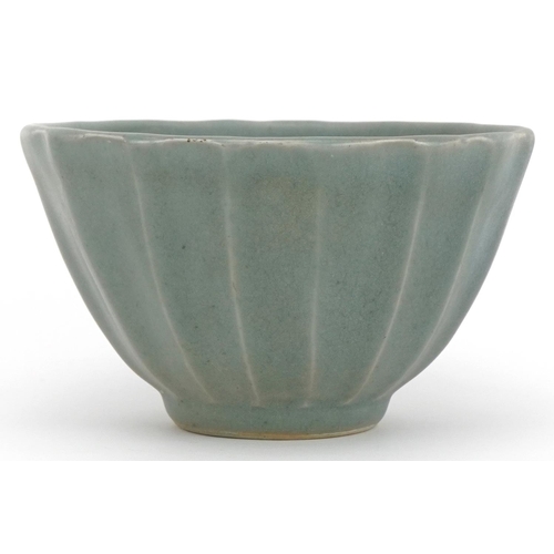 1526 - Chinese porcelain lotus bowl having a celadon glaze, 13.5cm in diameter