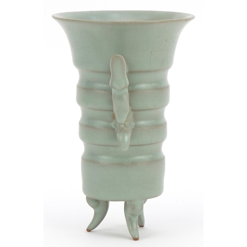 456 - Chinese porcelain tripod vase with twin handles having a celadon glaze, 15.5cm high