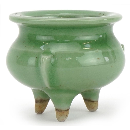 1445 - Miniature Chinese porcelain tripod censer having a celadon glaze, 5cm high