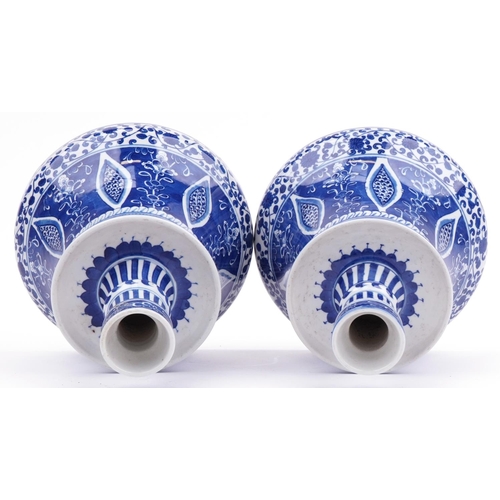 414 - Pair of Chinese Islamic blue and white porcelain hookah bases hand painted with flowers, each 24cm h... 