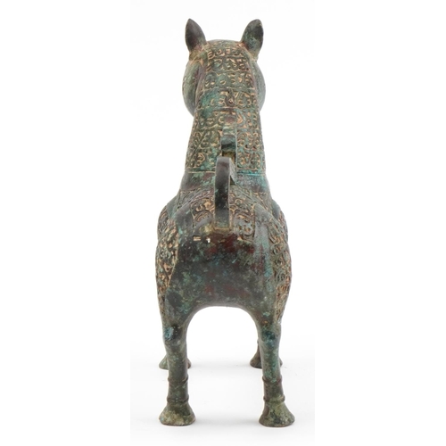 490 - Large Islamic verdigris patinated bronze mythical cat, 37cm in length