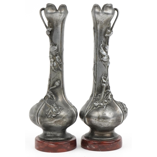 420 - Pair of French Art Nouveau cast metal vases decorated with flowers, indistinctly signed, each raised... 