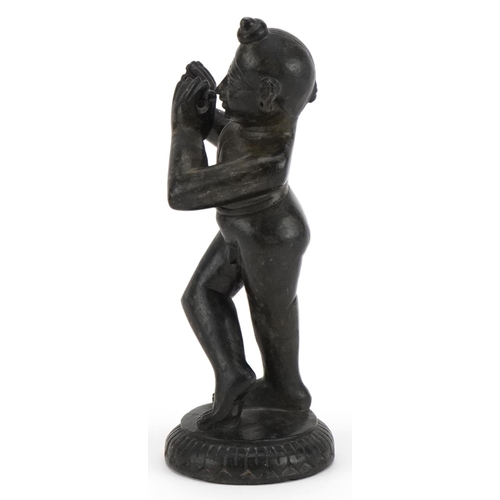 493 - Indian black stone carving of Krishna, 18cm high