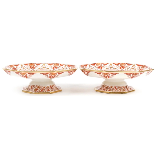 1475 - Pair of Minton comports decorated with flowers having octagonal dishes, each 23.5cm in diameter