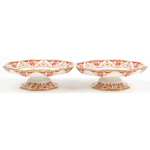 1475 - Pair of Minton comports decorated with flowers having octagonal dishes, each 23.5cm in diameter