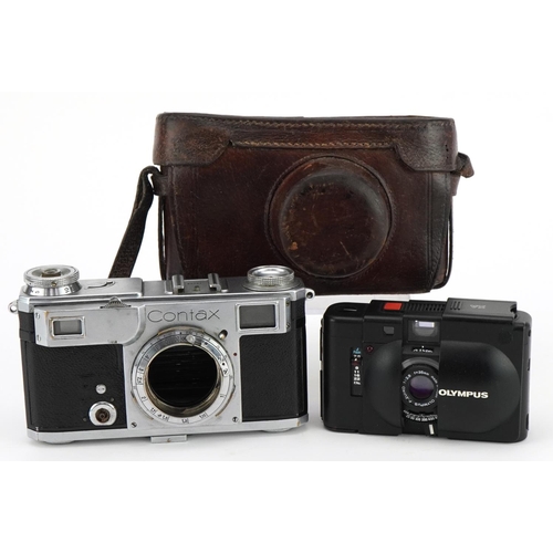 1353 - Two cameras comprising a vintage Contax with leather case, Zeiss Ikon Contax serial no 74929 and Oly... 