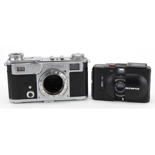 1353 - Two cameras comprising a vintage Contax with leather case, Zeiss Ikon Contax serial no 74929 and Oly... 