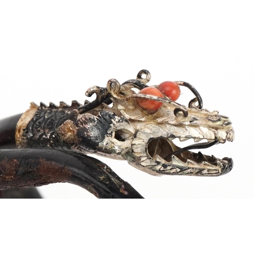 15 - Antique Chinese silver mounted gnarled wood bangle in the form of a dragon with coral eyes, 7.5cm in... 