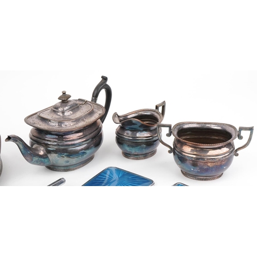 1650 - Silverplate and metalware comprising three piece tea service on tray and three piece guilloche ename... 