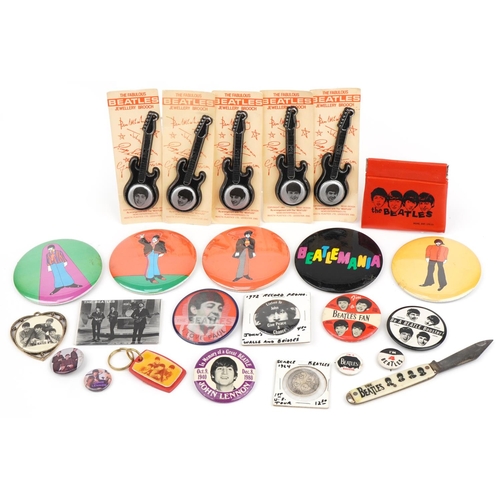 Good collection of vintage Beatles collectables including pin badges, some in the form of a guitar on cardboard backs, keyrings and folding knife