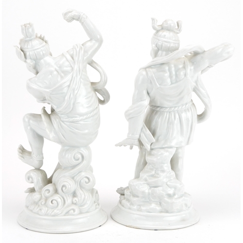 1705 - Pair of Fitz & Floyd porcelain figures of Chinese warriors having blanc de chine glazes, 30.5cm high