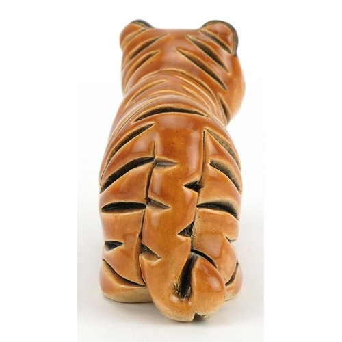 1298 - Mid century style stylised pottery tiger, incised marks to the base, 13.5cm in length